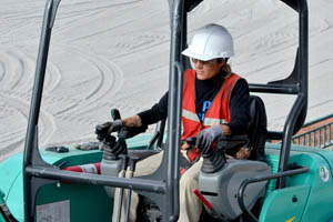 woman operating heavy equipment